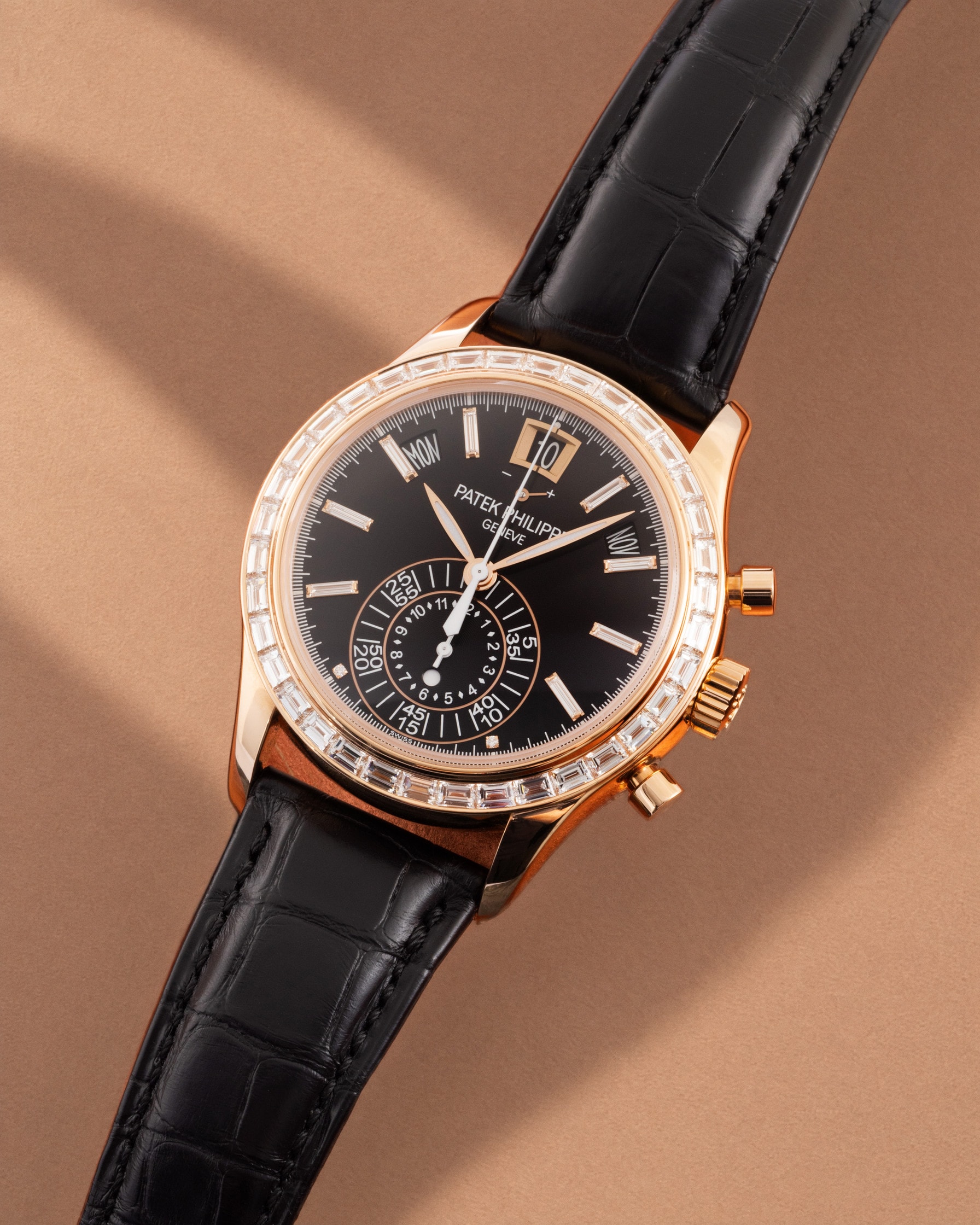 Patek Philippe annual calendar chronograph in rose gold on warm salmon paper